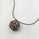 worm ball pendant made from clay