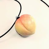 an orange and coral peach handmade from polymer clay